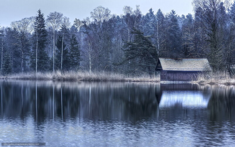 Cabin by the lake in winter
