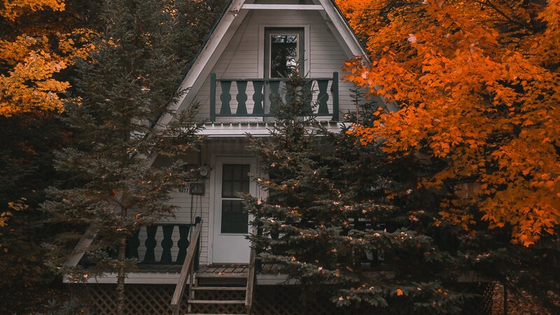 Cabin in Autumn Forest — Orange, Serene, Photograph, Trees, Porch