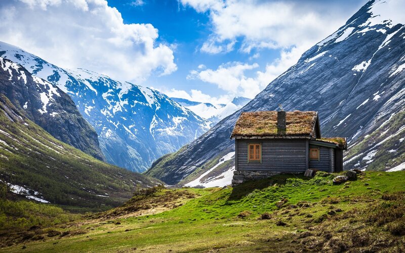Cabin in Mountain Valley — Green, Serene, Afternoon, Photograph, Mountains