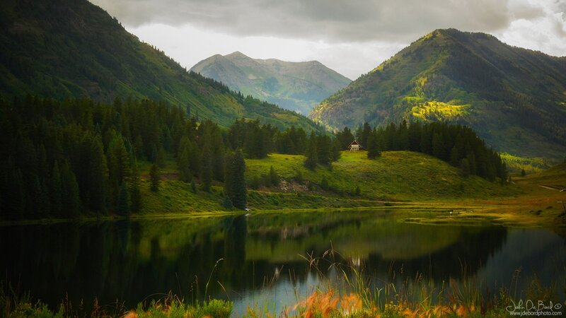 Cabin in Mountain Valley — Green, Serene, Afternoon, Photograph