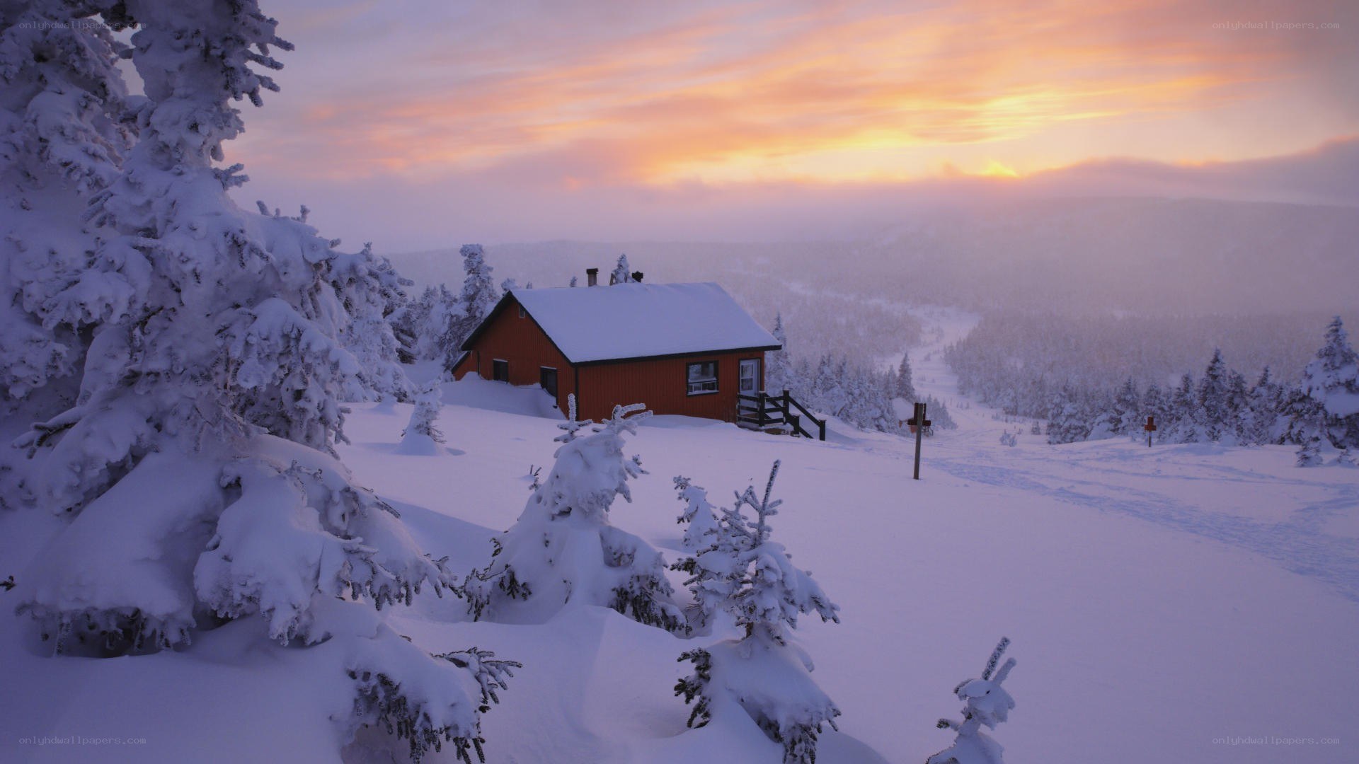 Cabin in snowy mountain landscape