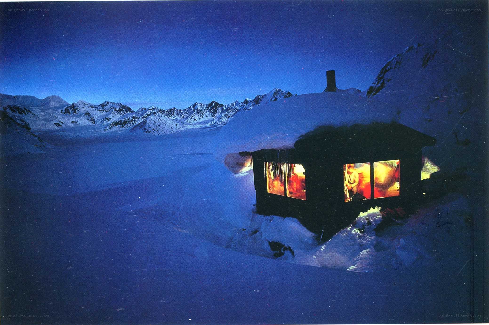 Cabin in snowy mountains