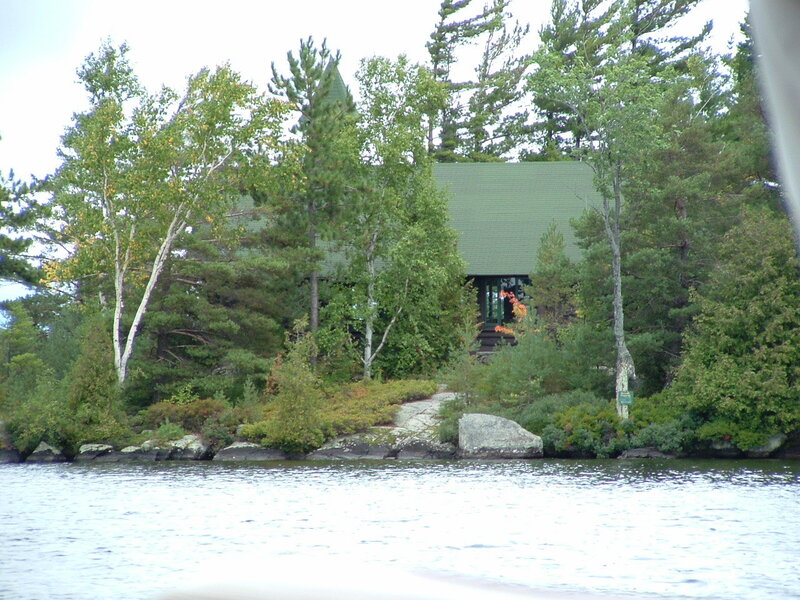 cabin on a forested island