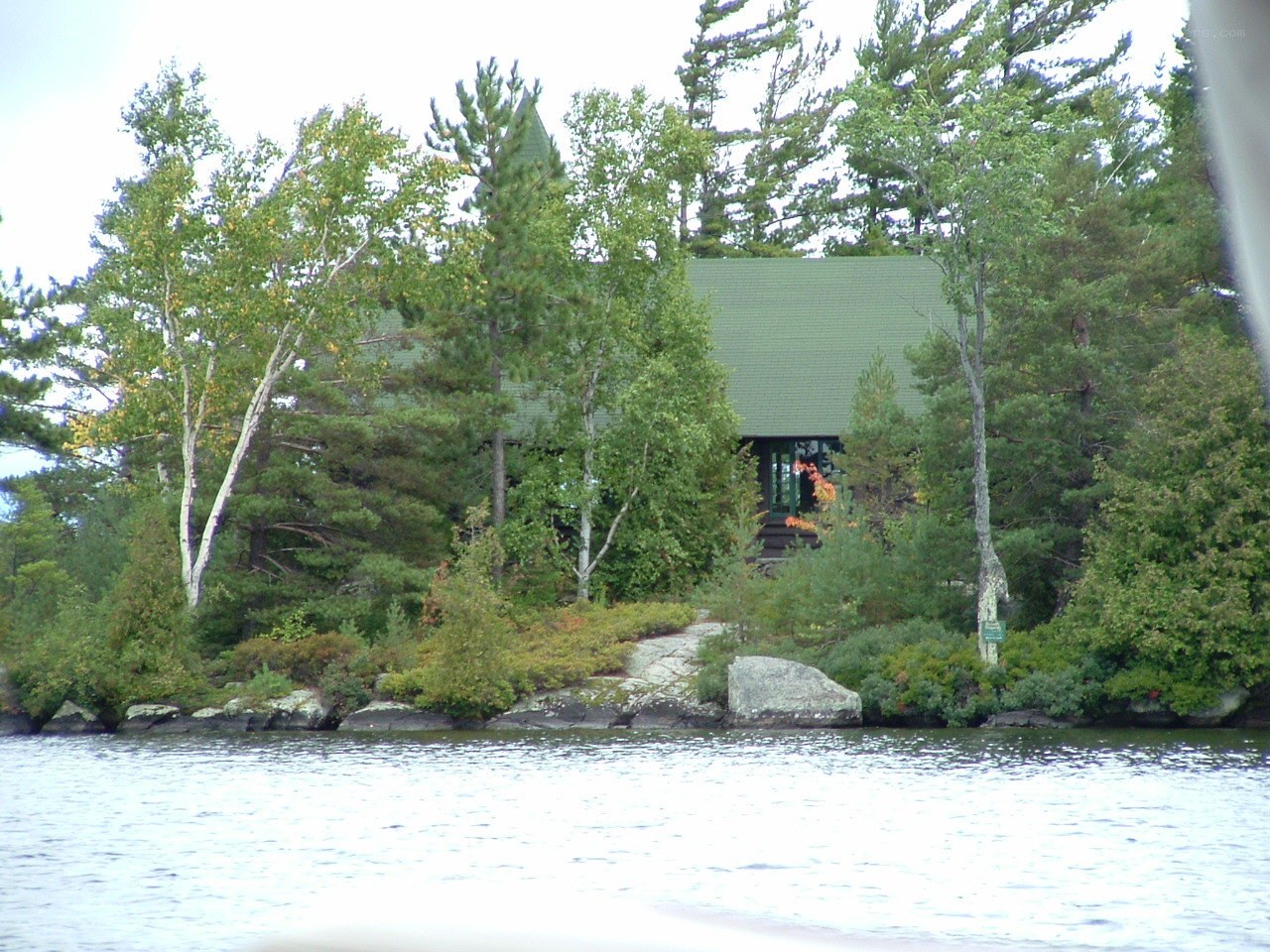 cabin on a forested island