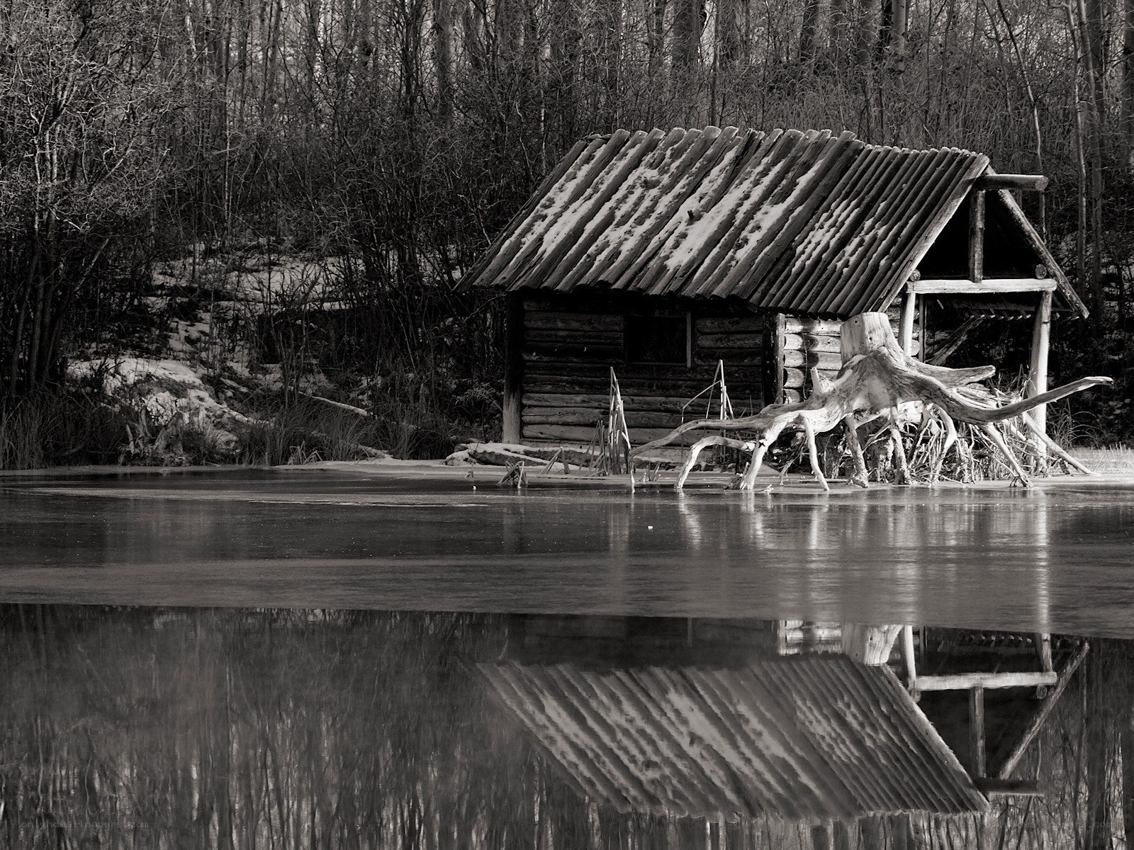 Cabin on a frozen lake