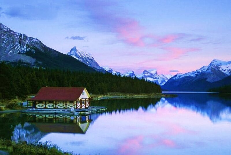 Cabin on a lake at dusk
