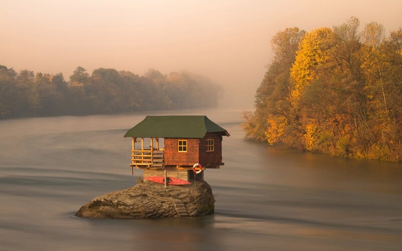 Cabin on Rock Island — Brown, Serene, Autumn, Photograph, River, Trees