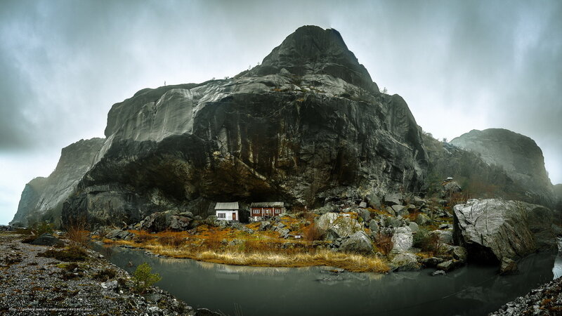 Cabin under a rocky cliff