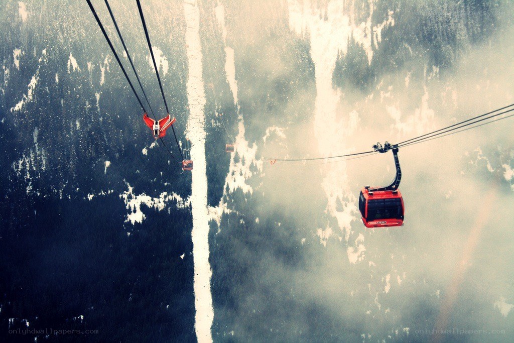 Cable cars over snowy mountains