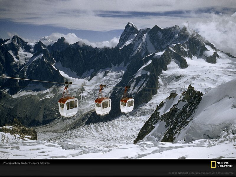 Cable cars over snowy mountains