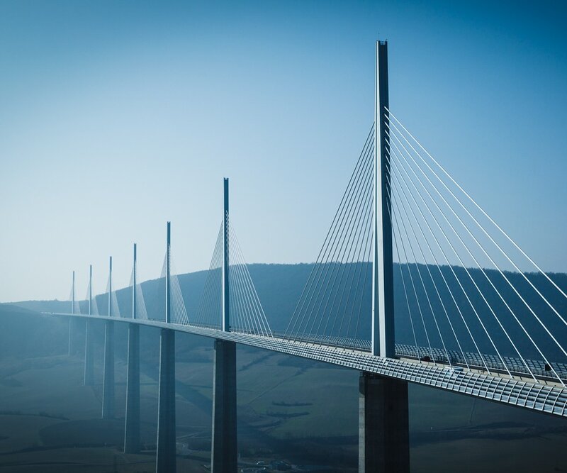 Cable-stayed Bridge — Blue, Serene, Afternoon, Photograph, Mountains, Sky, Road