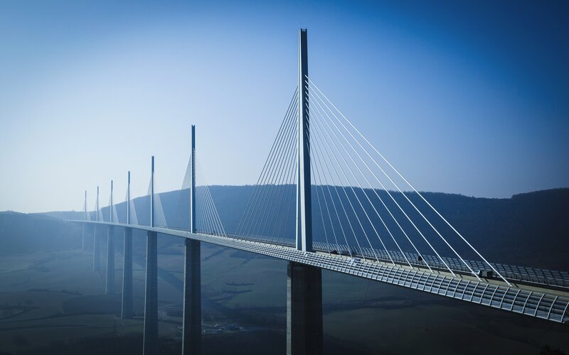 Cable-stayed Bridge — Blue, Serene, Morning, Photograph, Mountains, Sky, Road
