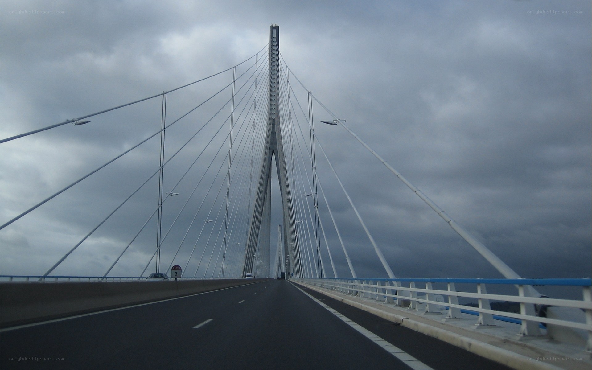 Cable-stayed bridge under cloudy sky
