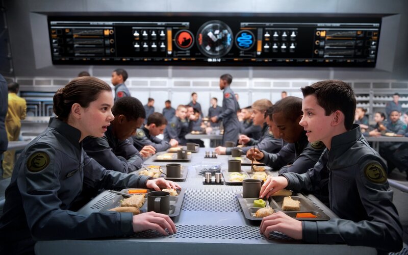 Cadets eating in a futuristic mess hall