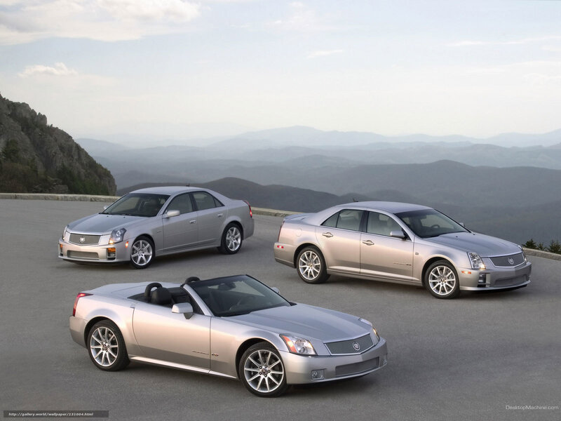 Cadillac cars on mountain overlook