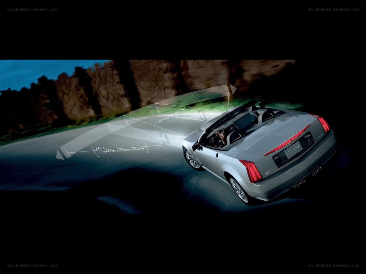 Cadillac convertible driving at night
