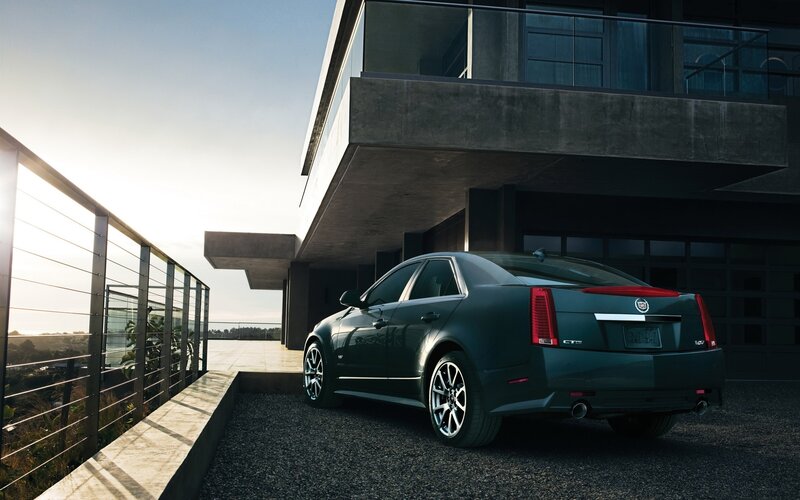 Cadillac CTS-V parked outside modern home