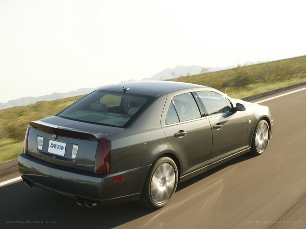 Cadillac driving on a road