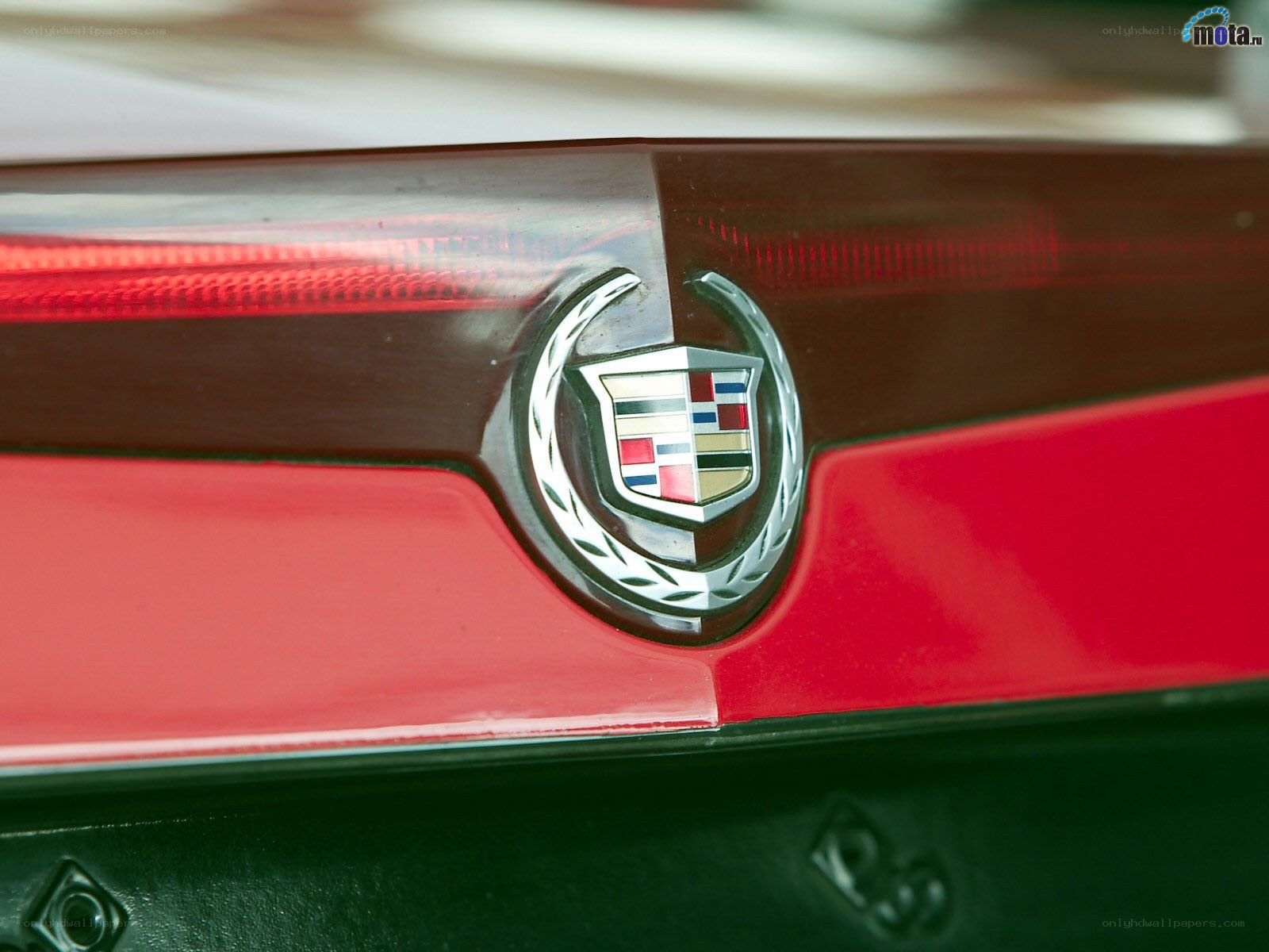 Cadillac emblem on red car
