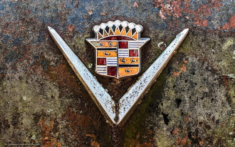 Cadillac emblem on rusted surface