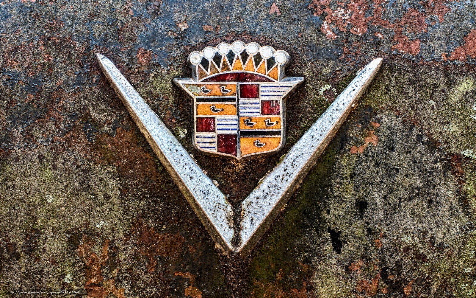Cadillac emblem on rusted surface