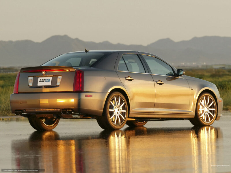 Cadillac sedan on wet pavement