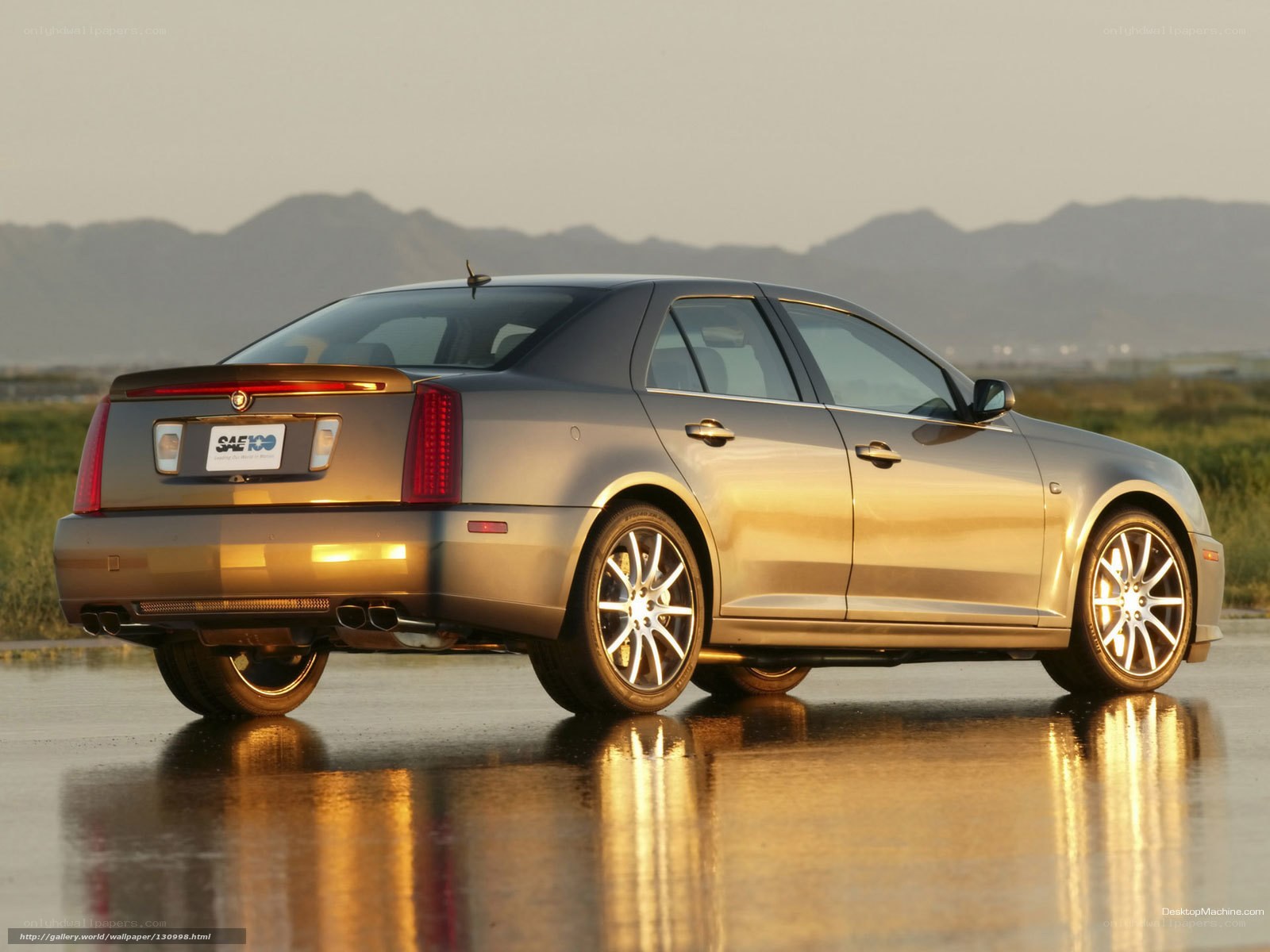 Cadillac sedan on wet pavement