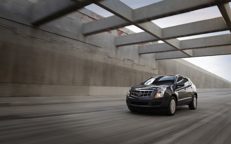 Cadillac SRX driving on highway