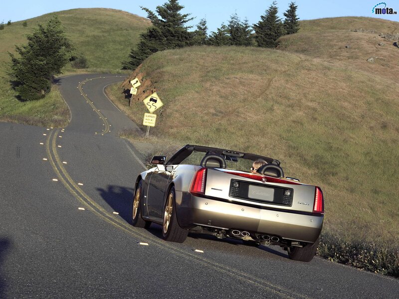 Cadillac XLR driving on a winding road