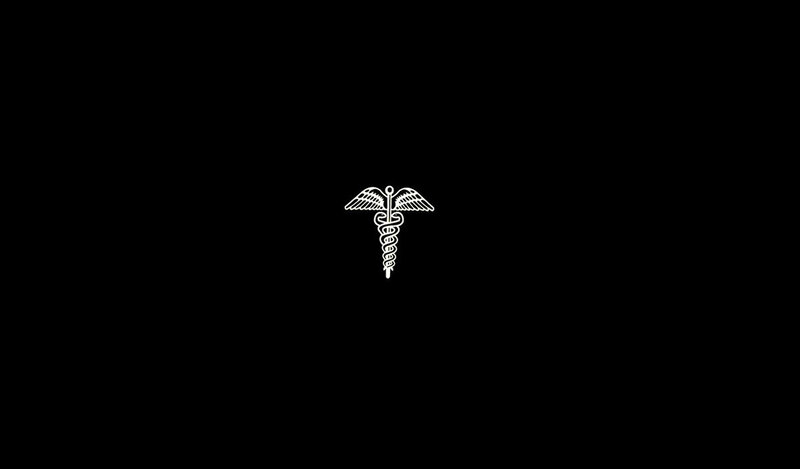 Caduceus symbol on black background