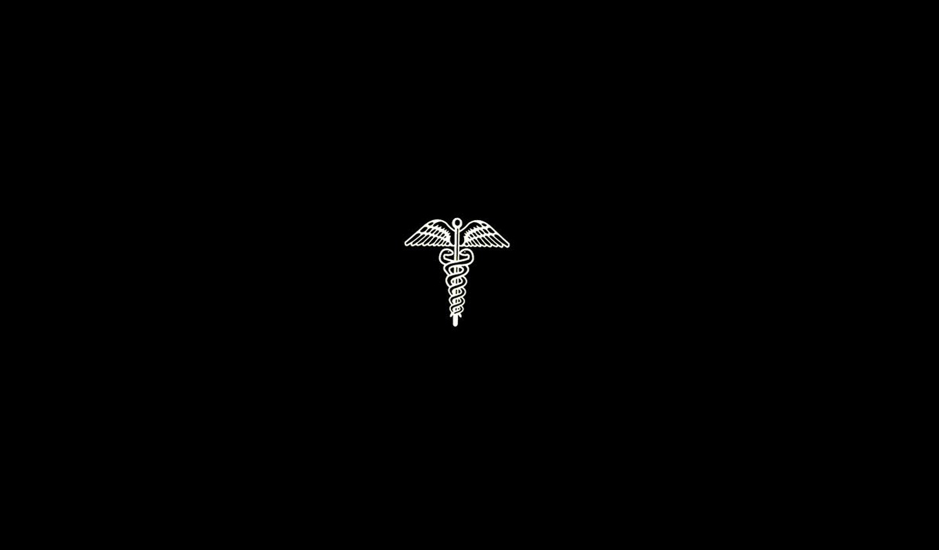 Caduceus symbol on black background