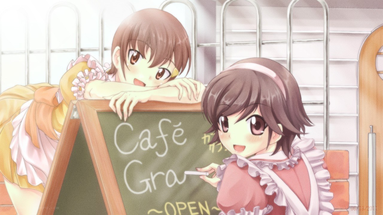 Cafe Gra sign with two girls