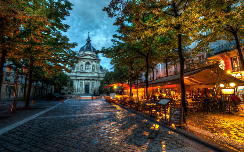 Cafe on Cobblestone Street — Yellow, Dramatic, Sunset, Photograph, Trees
