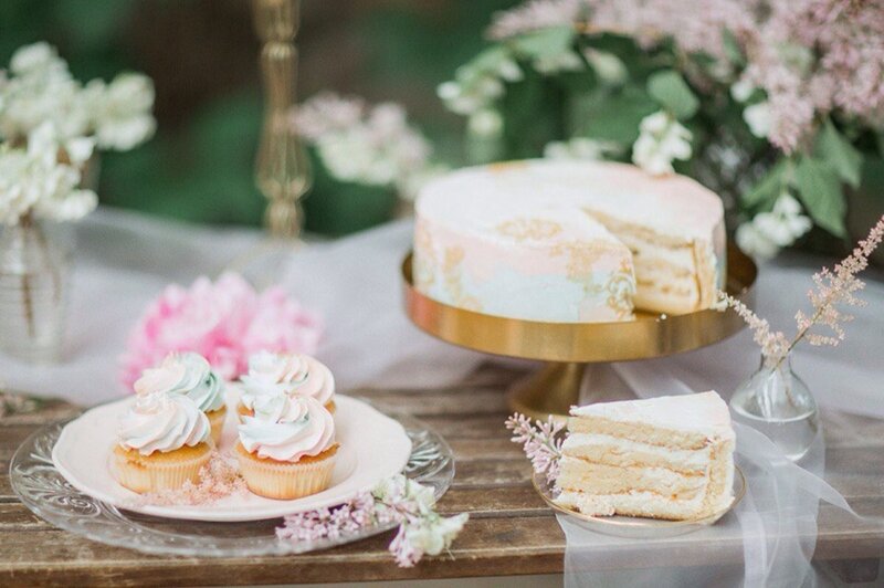 Cake and Cupcakes on Table