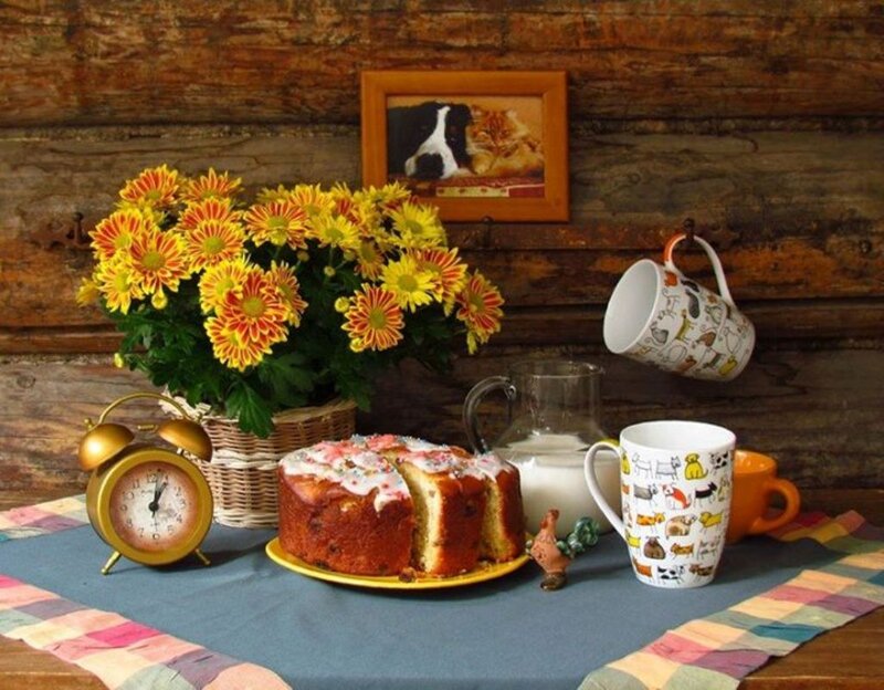 Cake and Flowers on Table