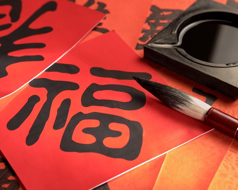 Calligraphy Brush on Red Paper