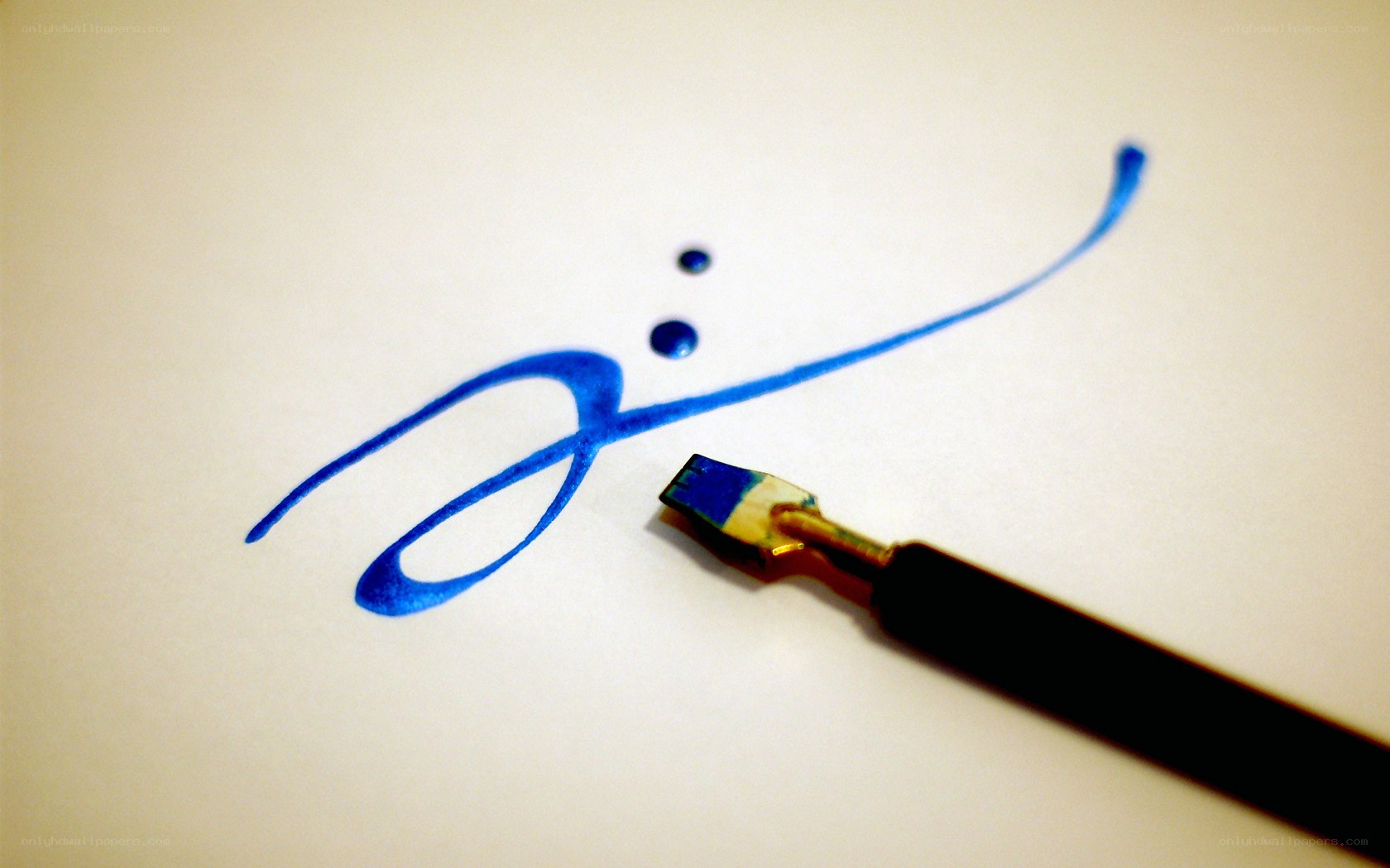 calligraphy pen writing on paper