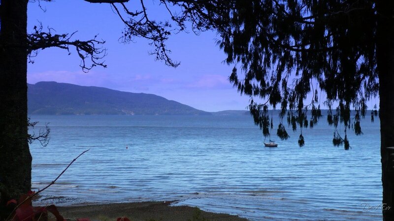 Calm bay with boat and mountains