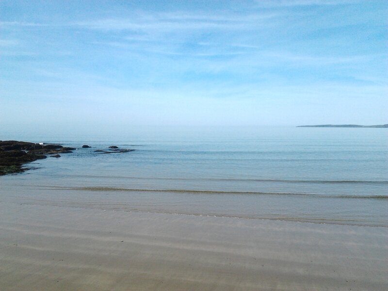 Calm Beach with Rocks — Blue