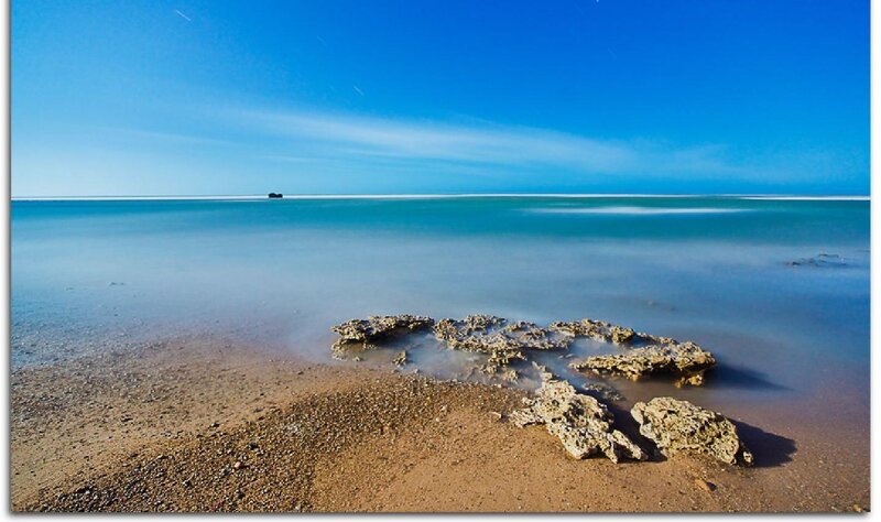 calm beach with rocks
