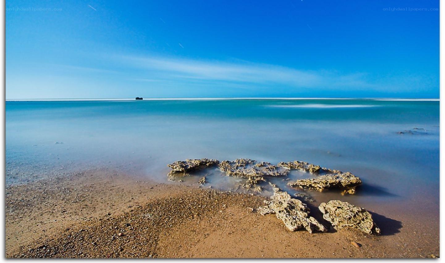 calm beach with rocks