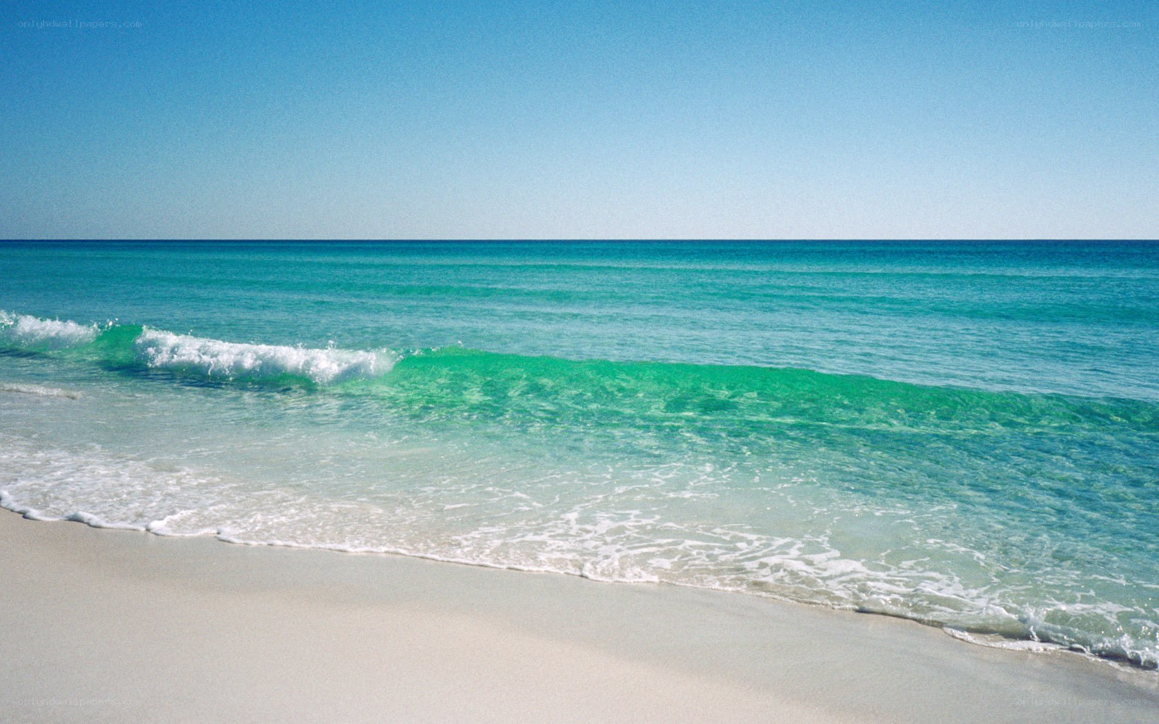 Calm beach with turquoise waves