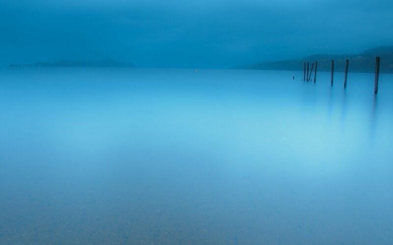 calm blue lake at dawn