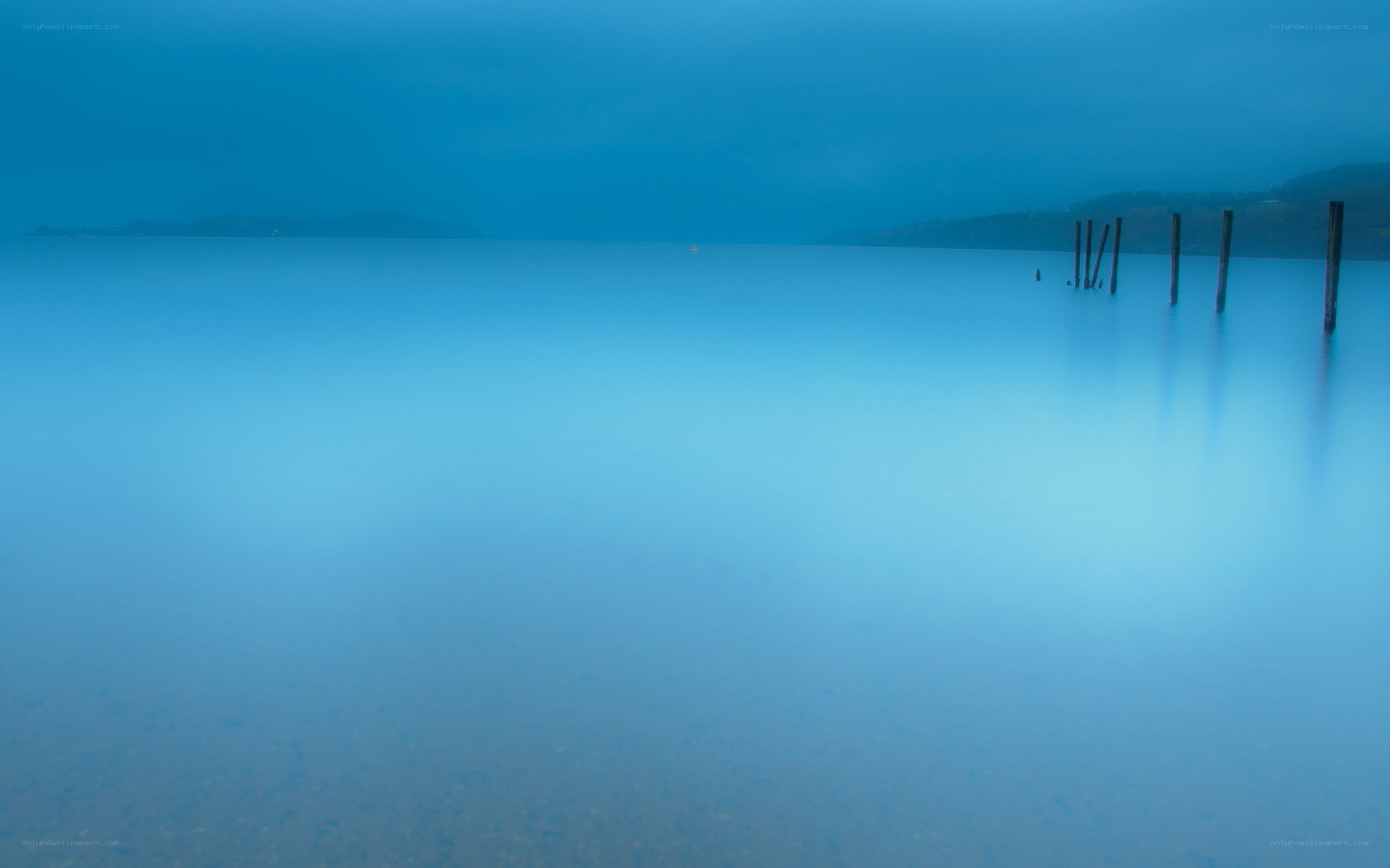 calm blue lake at dawn