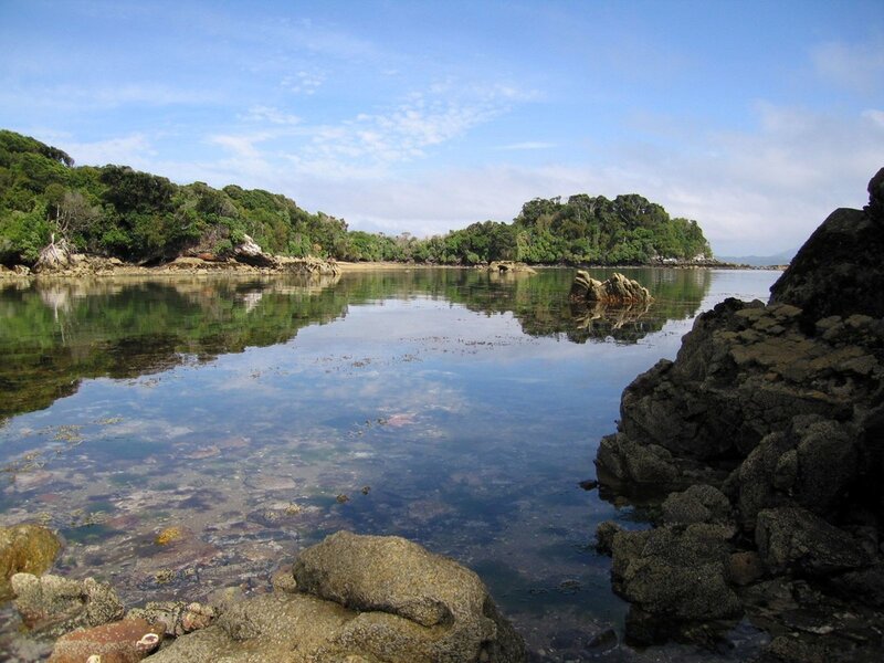 calm coastal cove with rocky shore