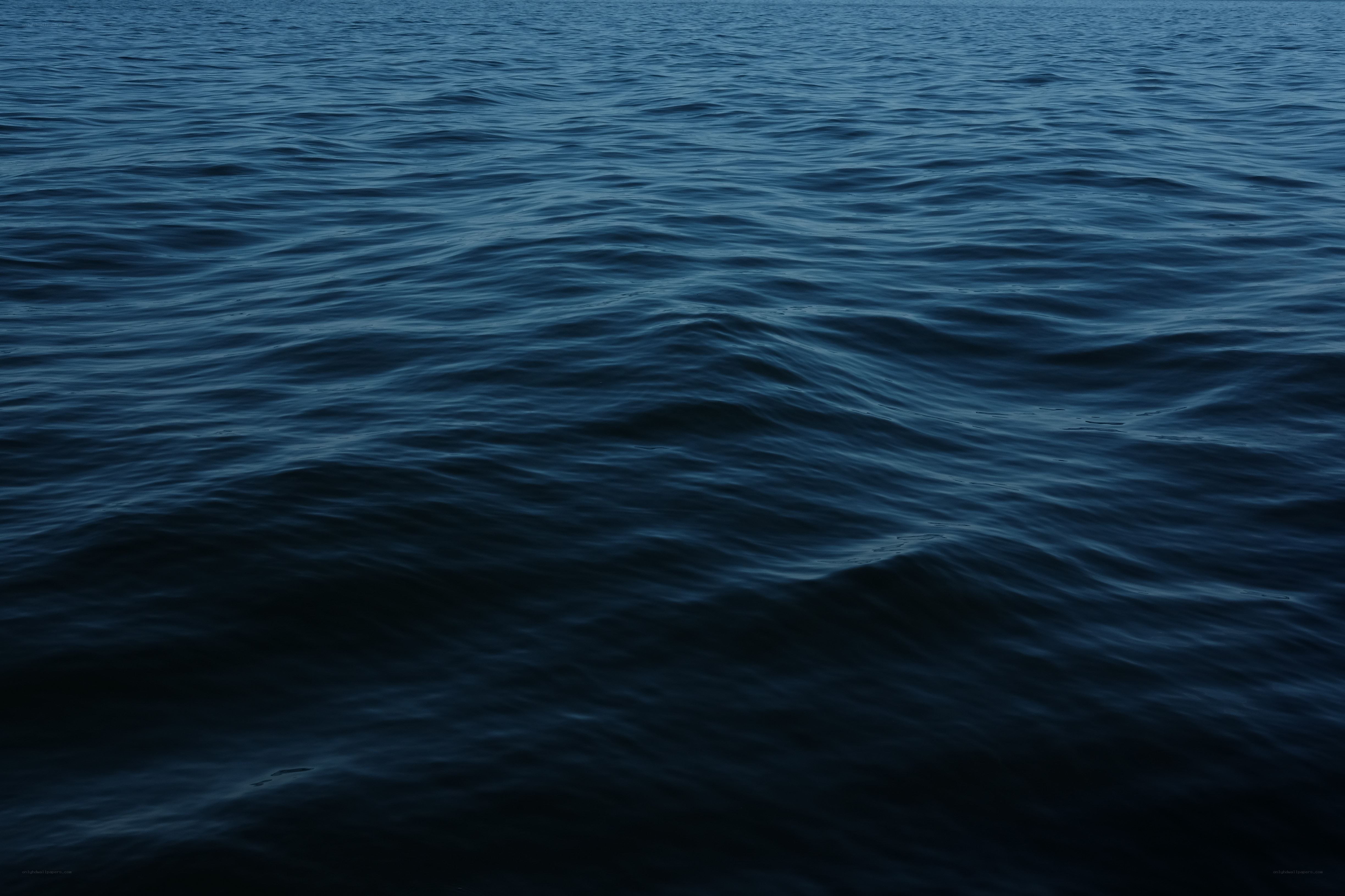 calm dark blue water surface