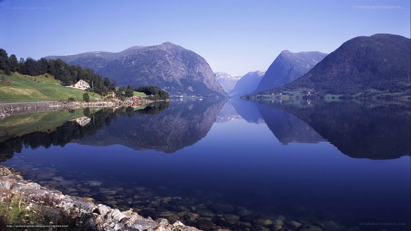 Calm fjord with mountain reflections