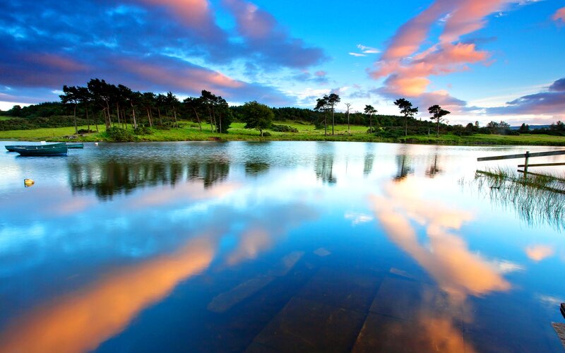 Calm Lake at Dusk — Blue, Serene, Sunset, Photograph, Trees, Boats