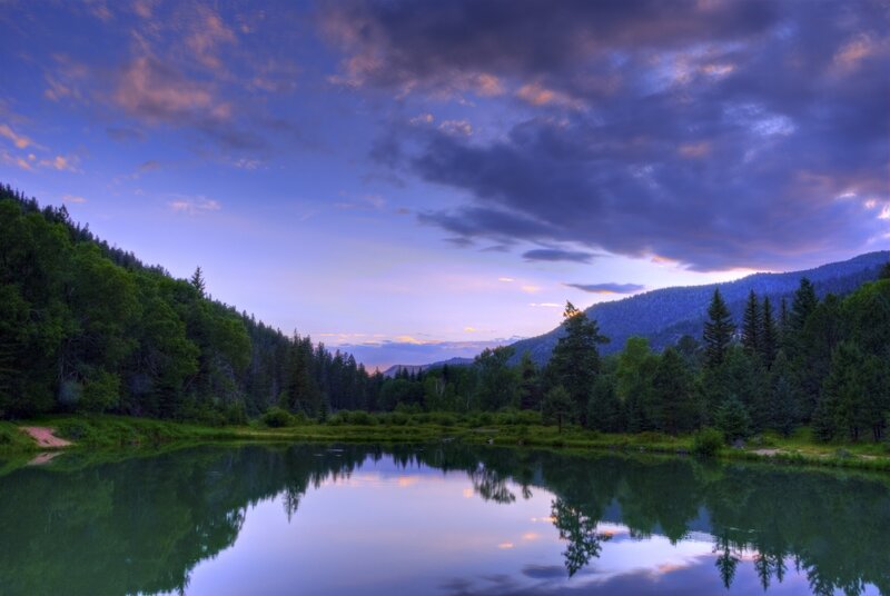 Calm Lake at Dusk — Blue, Serene, Sunset, Photograph, Trees, Mountains