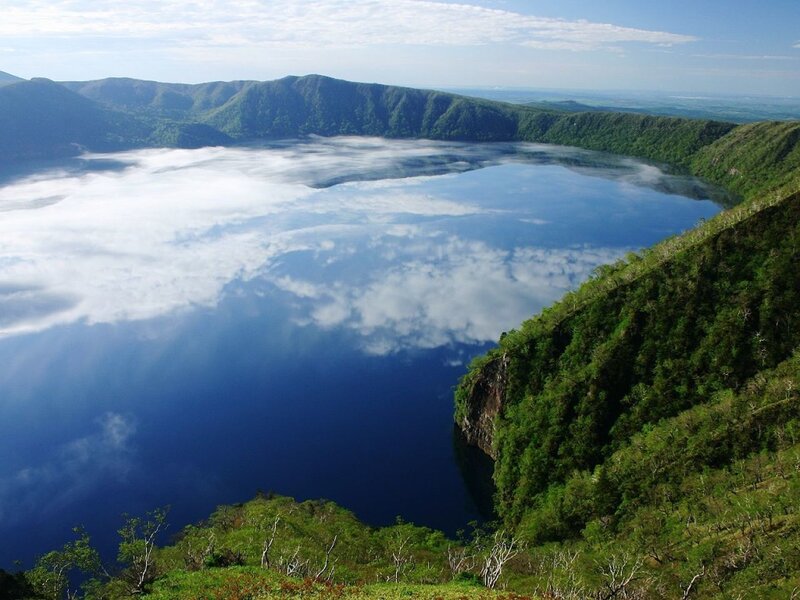 calm lake in volcanic crater